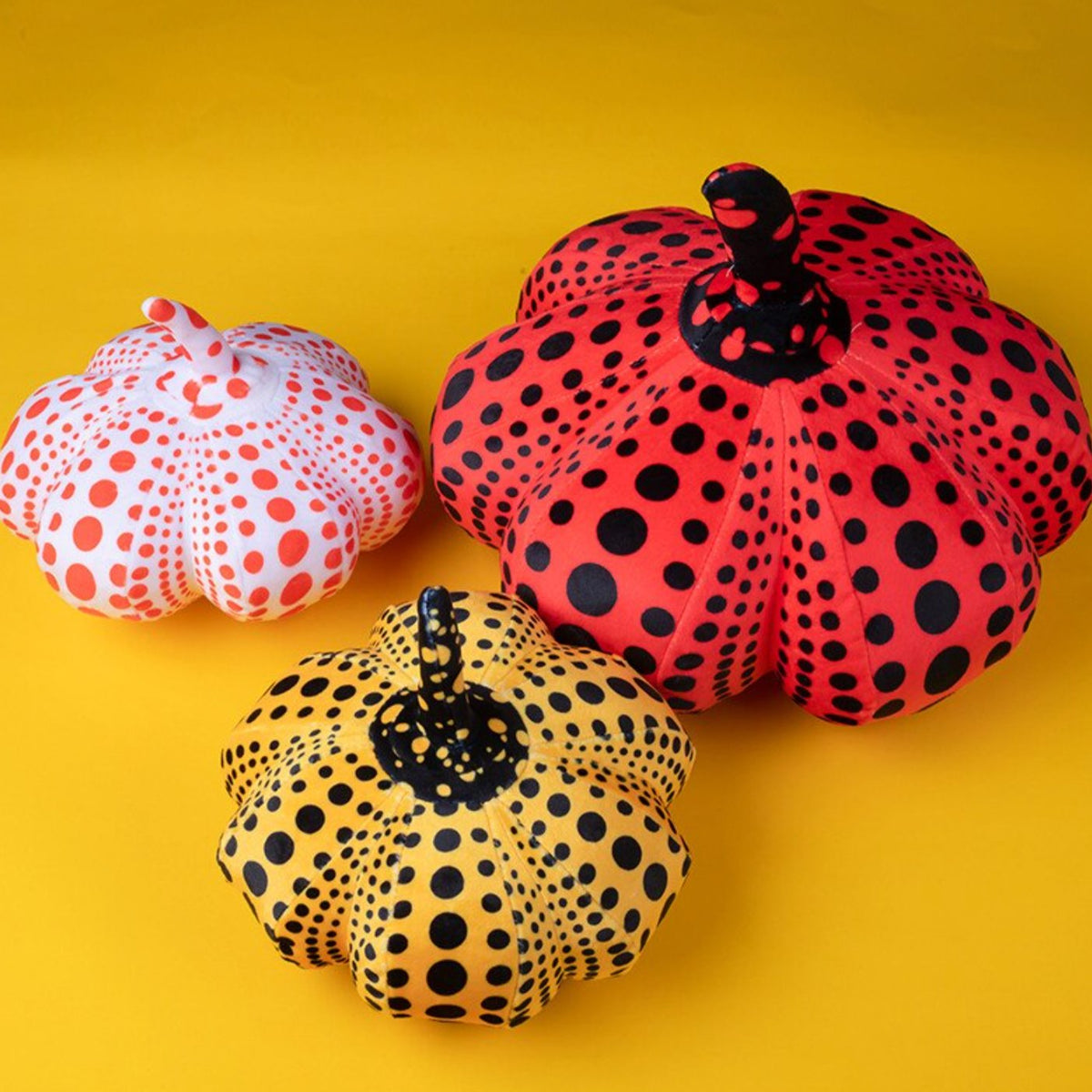 Delightfully Spooky Yayoi Kusama Pumpkin Plushies for Halloween Fun